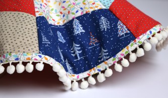 _naughty-or-nice-fabric_tree-skirt-tied_detail-2